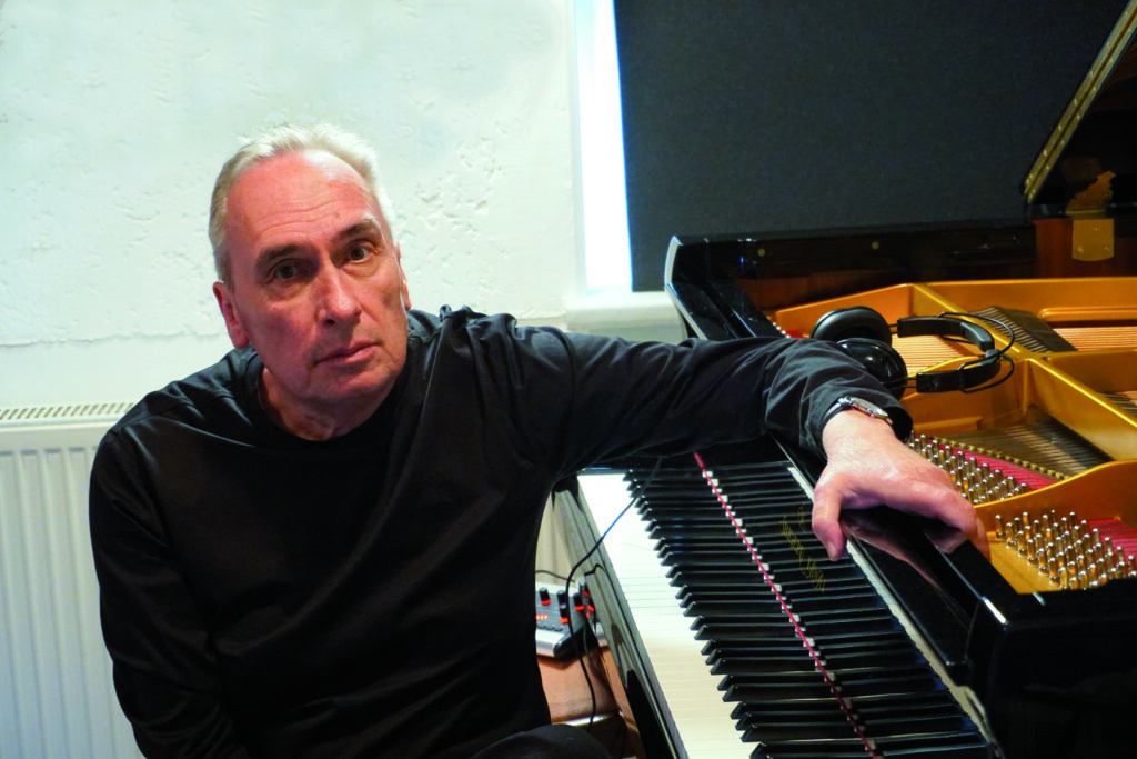 Andy Lumpp sitting at a grand piano